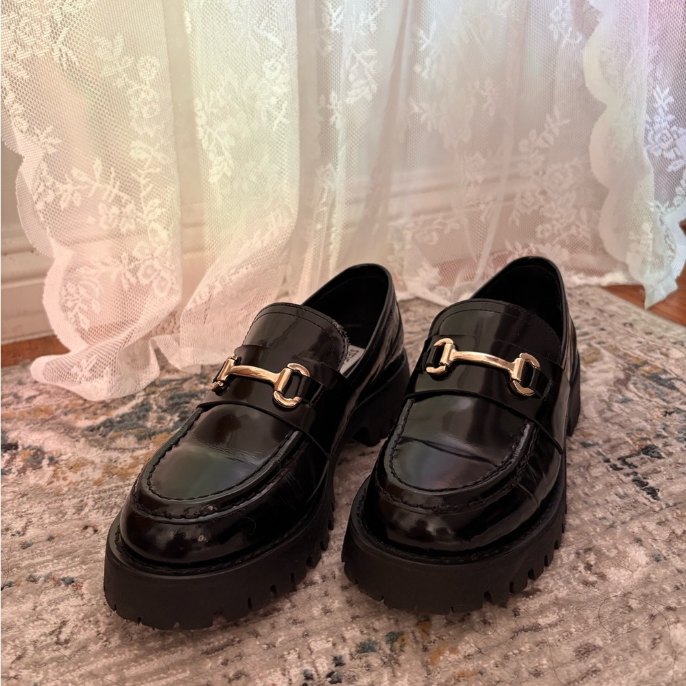 Steve Madden Shiny Black Loafers with Gold Accent